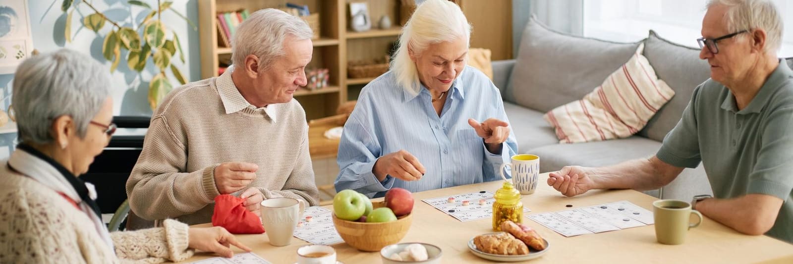 Friends enjoying a game at the table